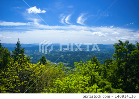 A spectacular view from the observation rock at the summit of Mt. Kasagi in Ena City, Gifu Prefecture. A spectacular view from the observation rock at the summit of Mt. Kasagi in Ena City, Gifu Prefecture. 140914136