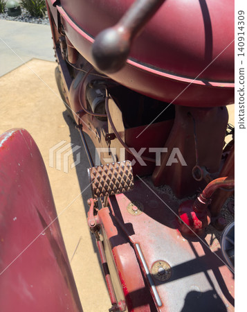 Vintage red tractor, vehicle Machine that reflects agricultural history Vintage red tractor, vehicle Machine that reflects agricultural history 140914309