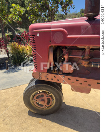 Vintage red tractor, vehicle Machine that reflects agricultural history Vintage red tractor, vehicle Machine that reflects agricultural history 140914314