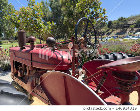 Vintage red tractor, vehicle Machine that reflects agricultural history Vintage red tractor, vehicle Machine that reflects agricultural history 140914319