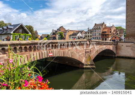 Stone bridge and traditional houses in Strasbourg, France 140915041
