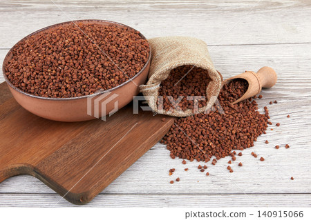 Raw buckwheat on wood Raw buckwheat on wood 140915066