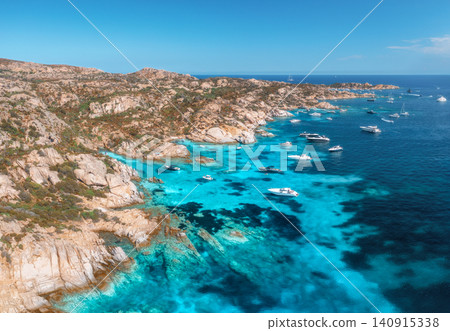 Aerial view of luxury yachts and boats on blue sea, island Aerial view of luxury yachts and boats on blue sea, island 140915338