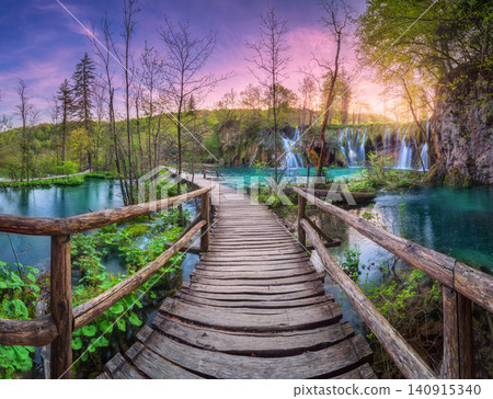 Waterfall and wooden path in green forest in Plitvice Lakes Waterfall and wooden path in green forest in Plitvice Lakes 140915340