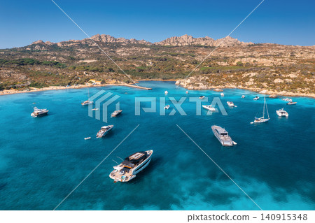Aerial view of luxury yachts and boats on blue sea, island Aerial view of luxury yachts and boats on blue sea, island 140915348