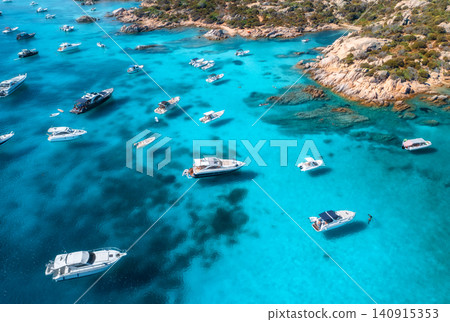 Aerial view of luxury yachts and boats on blue sea, island Aerial view of luxury yachts and boats on blue sea, island 140915353