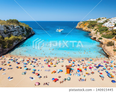 Aerial view of colorful umbrellas on sandy beach, swimming people Aerial view of colorful umbrellas on sandy beach, swimming people 140915445