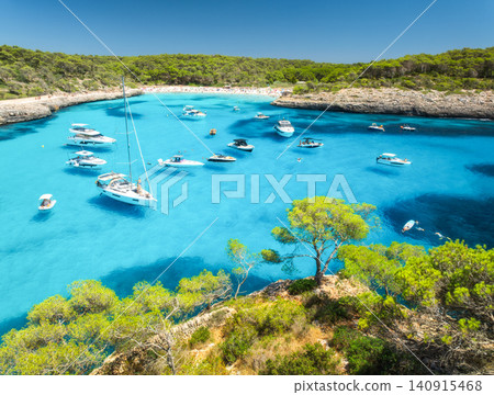 Aerial view of yachts and boats anchored in turquoise sea bay Aerial view of yachts and boats anchored in turquoise sea bay 140915468