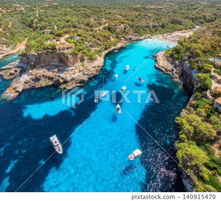 Aerial view of boats and yachts in crystal clear turquoise sea Aerial view of boats and yachts in crystal clear turquoise sea 140915470