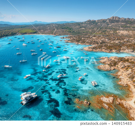 Aerial view of luxury yachts and boats on blue sea, island Aerial view of luxury yachts and boats on blue sea, island 140915483