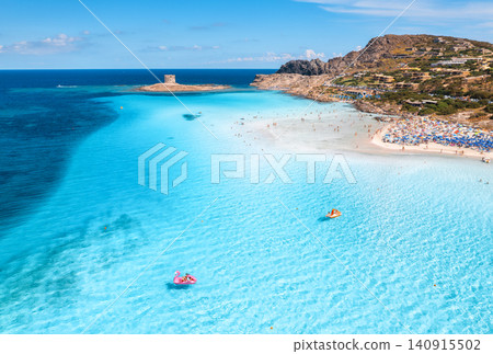 Aerial drone view of La Pelosa sandy beach and blue sea in summer Aerial drone view of La Pelosa sandy beach and blue sea in summer 140915502