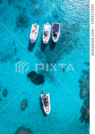 Aerial view of luxury yacht and boat in blue sea in summer Aerial view of luxury yacht and boat in blue sea in summer 140915504