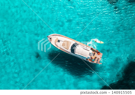 Aerial view of luxury yacht and boat in blue sea in summer Aerial view of luxury yacht and boat in blue sea in summer 140915505