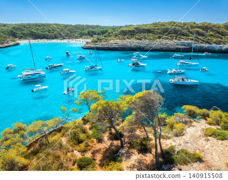 Aerial view of yachts and boats anchored in turquoise sea bay Aerial view of yachts and boats anchored in turquoise sea bay 140915508