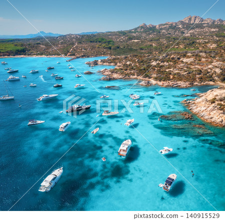Aerial view of luxury yachts and boats on blue sea, island Aerial view of luxury yachts and boats on blue sea, island 140915529