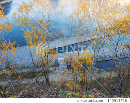 Zakrzowek Park lake boardwalk during autumn Zakrzowek Park lake boardwalk during autumn 140915716