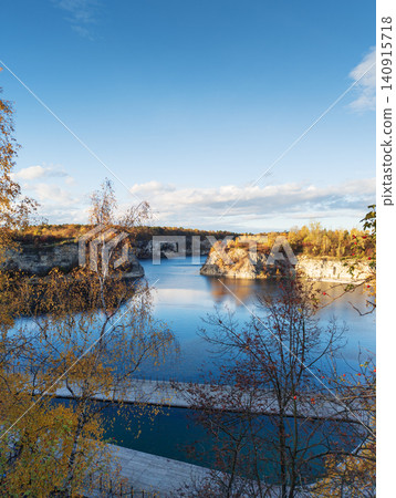 Zakrzowek quarry lake landscape during autumn Zakrzowek quarry lake landscape during autumn 140915718