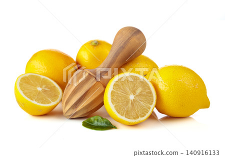 Fresh lemons and wooden juicer isolated on a white background. Fresh lemons and wooden juicer isolated on a white background. 140916133