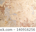 Old plaster wall showing peeling paint texture 140916256