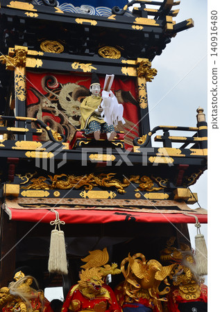 Inuyama Festival in Aichi Prefecture, Japan: Floats called "Kurumayama" carrying mechanical dolls; children wearing gold kimono costumes beating small drums. Inuyama Festival in Aichi Prefecture, Japan: Floats called "Kurumayama" carrying mechanical dolls; children wearing gold kimono costumes beating small drums. 140916480