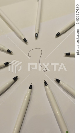 Creative Question Mark Design with Pens on White Paper Creative Question Mark Design with Pens on White Paper 140917480