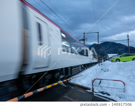 Nagano Electric Railway Snow Monkey train and Yudanaka Station platform 140917506
