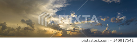 Evening sunset sky with colorful clouds. Panoramic skyscape Evening sunset sky with colorful clouds. Panoramic skyscape 140917541