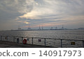 The sea, cranes, and a cloudy sky 140917973