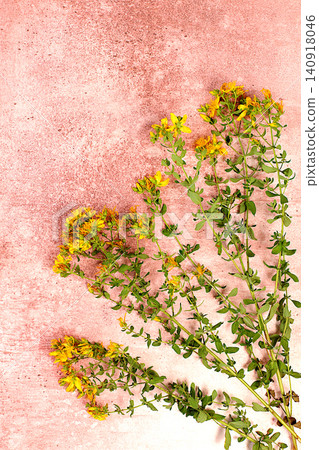 Hypericum flowers on a concrete table, herbal remedies, alternative folk medicine concept, green pharmacy advertisement, collection of useful herbs for folk medicine, source of vitamins Hypericum flowers on a concrete table, herbal remedies, alternative folk medicine concept, green pharmacy advertisement, collection of useful herbs for folk medicine, source of vitamins 140918046