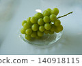Shine Muscat grapes served on a transparent plate 140918115