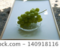 Shine Muscat grapes on a glass plate 140918116
