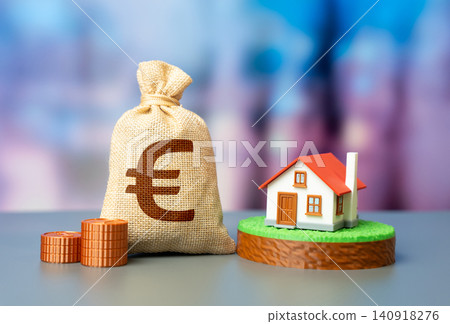 The Euro money bag and a private house with a plot of land. Property investment builds wealth. Buying a house, investing in real estate. Housing market trends reflect economic growth. 140918276