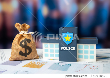 Police building and a dollar money bag. Law enforcement budget. Expense optimization, improved working conditions for law enforcement officers, and financial growth. Budget replenishment through fines Police building and a dollar money bag. Law enforcement budget. Expense optimization, improved working conditions for law enforcement officers, and financial growth. Budget replenishment through fines 140918320