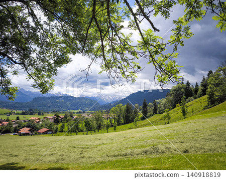 Panoramic view of Allgau Alps with green meadows and alpine village in summer - Sonthofen, Bavaria, Germany Panoramic view of Allgau Alps with green meadows and alpine village in summer - Sonthofen, Bavaria, Germany 140918819