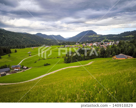 Panoramic view of Allgau Alps with green meadows and alpine village in summer - Sonthofen, Bavaria, Germany Panoramic view of Allgau Alps with green meadows and alpine village in summer - Sonthofen, Bavaria, Germany 140918829