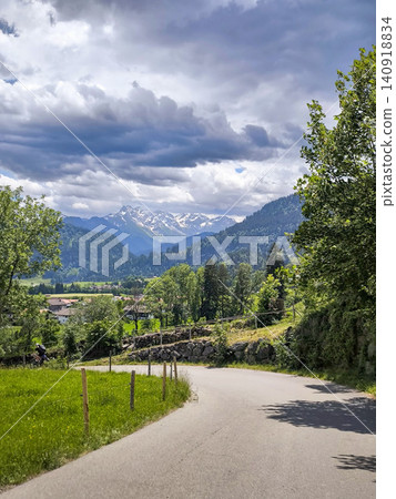 Panoramic view of Allgau Alps with green meadows and alpine village in summer - Sonthofen, Bavaria, Germany Panoramic view of Allgau Alps with green meadows and alpine village in summer - Sonthofen, Bavaria, Germany 140918834