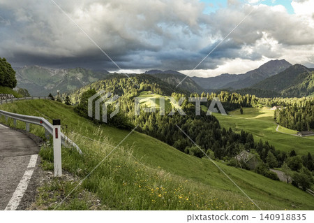 Panoramic view of Allgau Alps with green meadows and alpine village in summer - Sonthofen, Bavaria, Germany Panoramic view of Allgau Alps with green meadows and alpine village in summer - Sonthofen, Bavaria, Germany 140918835