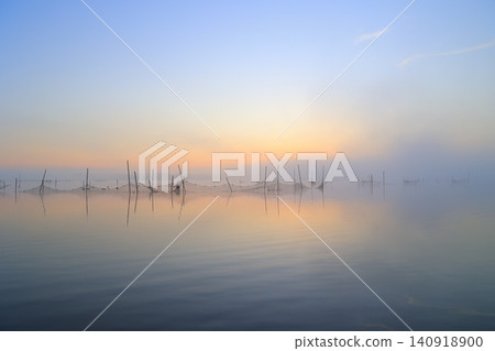 Lake shining in the morning sun Lake shining in the morning sun 140918900