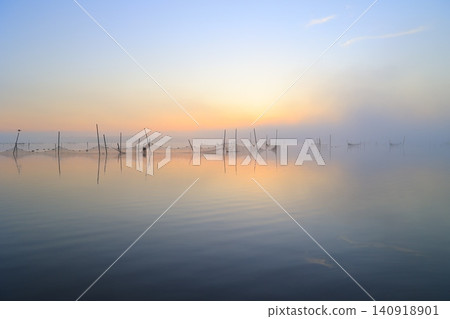 Lake shining in the morning sun Lake shining in the morning sun 140918901