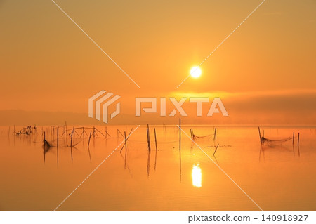 Lake shining in the morning sun Lake shining in the morning sun 140918927