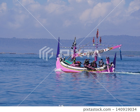 MUNCAR, INDONESIA - JULY 1, 2026: Traditional decorated fishing boats participate in the annual Petik Laut ceremony, a cultural sea offering and thanksgiving event held by the local fishermen communit 140919034