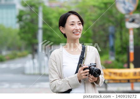 A woman with a camera A woman with a camera 140919272