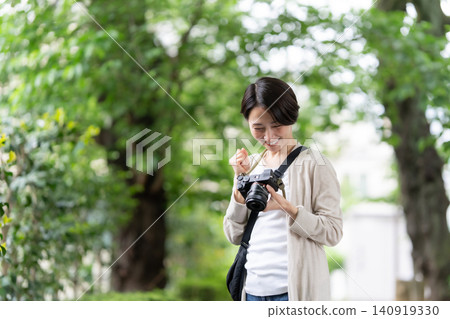 A woman with a camera A woman with a camera 140919330