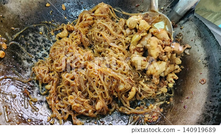 Authentic Thai Street Food Fried Noodles Pad Thai with Chicken in Wok 140919689