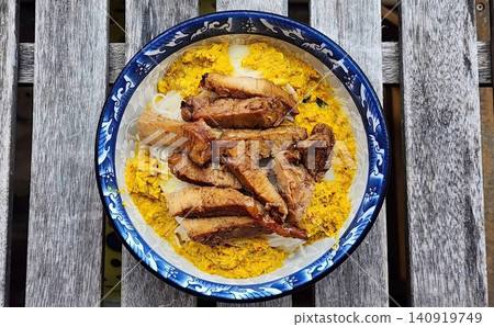 Thai Rice Noodles with Yellow Crab Curry and Grilled Pork in a Bowl Thai Rice Noodles with Yellow Crab Curry and Grilled Pork in a Bowl 140919749