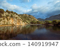 View of Dalyan River Delta and lagoon near Iztuzu Beach known as Turtle beach, Turkey. Wetlands, mountains and calm waterways create popular destination for summer travel, wildlife and nature tourism. 140919947