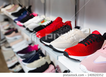 Shelves with training shoes in shoe store Shelves with training shoes in shoe store 140920352