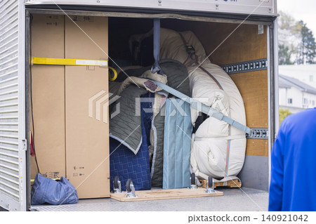 The back of a truck transporting a piano The back of a truck transporting a piano 140921042