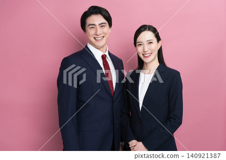 Young men and women in business suits - Business image Young men and women in business suits - Business image 140921387