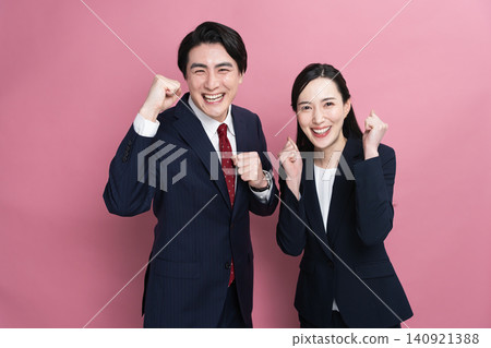Young men and women in business suits - Business image Young men and women in business suits - Business image 140921388